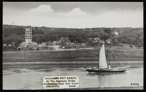A sailboat moves down the Cape Cod Canal