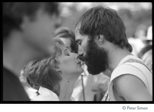 John Hall kissing an unidentified woman at the No Nukes concert and protest, Washington, D.C.