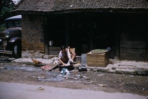 Young woman doing laundry