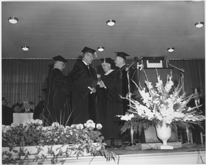 Charles Avila at his hooding ceremony during the Centennial Charter Day convocation