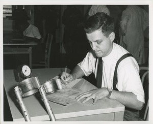 Frank Lettiere filling out paperwork as part of a clerical test