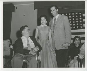 Unidentified man and woman on stage with client at Institute Day