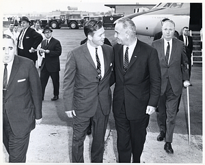 Mayor John F. Collins following Massachusetts Governor Endicott Peabody and President Lyndon B. Johnson away from U.S. Air Force plane