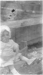 A young child in the Back Central Street neighborhood. [04]