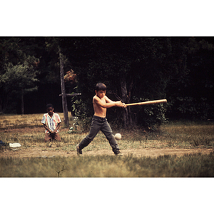 Boy swinging a baseball bat