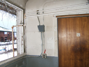 Interior view: electrical junction boxes; Mullins Center visible through window