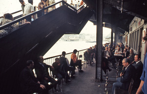 Men riding a ferry and smoking hookahs