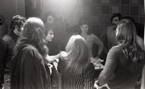 Commune members preparing for interview on the WGBY program Catch 44 (public access television show): Bruce Geisler and Anne and James Baker are in front right, backs to camera