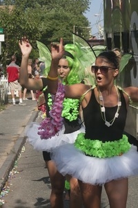 Parade marchers with green fairy wings and tutus : Provincetown Carnival parade