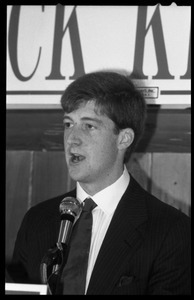 Patrick Kennedy campaign breakfast of ham and eggs at Caruso's Restaurant: close-up of Kennedy speaking at the podium beneath a sign reading 'Welcome to breakfast with Patrick Kennedy'