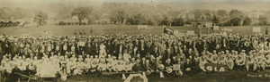 Alumnae gathered near field during 1921 commencement activities