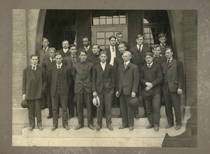 Class of 1906 students: group portrait on stairs of unidentified building