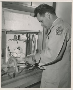 A technician makes a child's prosthetic brace