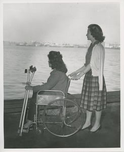 Two women look over the water