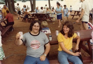 Man and woman at a picnic table (man, with beer, wearing a cocaine tee shirt), Pine Beach