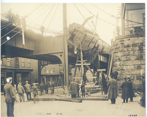 Forest Hills wreck, view from street of car hanging from tracks