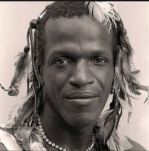 A Headshot of Marsha P. Johnson with Feathers in Her Hair
