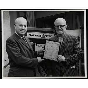 "Bob Emery (right) receives 'Great Guys' award from Arthur T. Burger (left), Executive Director of Boys' Clubs of Boston"