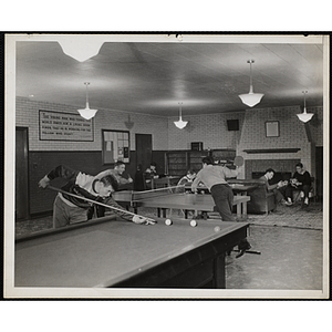 Teenage boys engaging in a variety of activities in the "Senior Club Room"