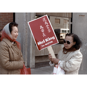 Women campaigning for Mel King