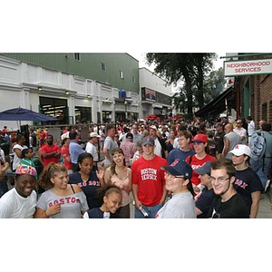 The Torch Scholars stand on Yawkey Way outside Fenway Park