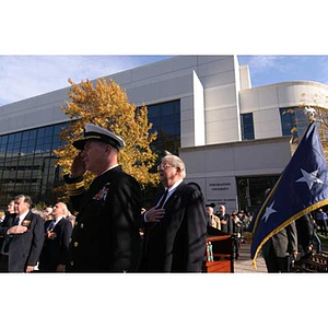 Mark Fitzgerald and Neal Finnegan with their hands over their hearts at the Veterans Memorial dedication