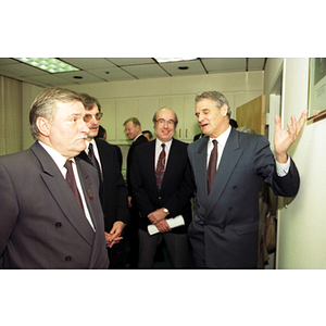 President Curry gestures while speaking to Lech Walesa at the inauguration of the International Degree Program