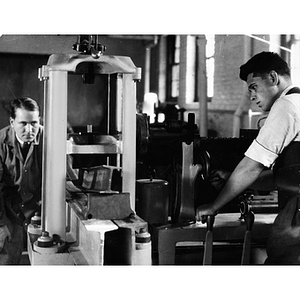 Civil engineering students conducting transverse bending test