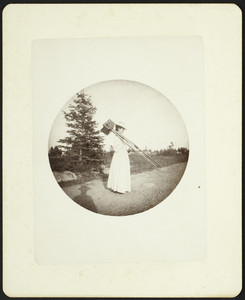 Woman with a view camera, location unknown, undated