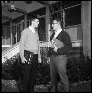 Greg Landry (quarterback, left) and Jim Mitchell (tackle), UMass Amherst football co-captains for 1967-1968, outside Boyden Gymnasium