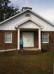 Marjorie Merrill on the front steps of the Antioch Missionary Baptist Church