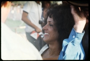 Grace Slick (Jefferson Airplane) seated off stage at the Woodstock Festival