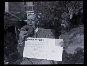 Henry A. Ellis and the doughnut: Ellis seated with oversized donut and a "Do-nut post card"