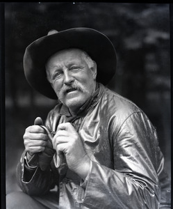 Unidentified man with pipe and cowboy hat