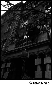 Umoja (Black student union) activists hoisting a television to occupiers of the administration building, Boston University