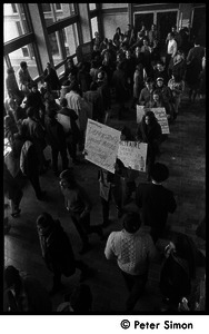 Demonstration against Marine recruiters: crowd in Boston University Student Union, protesters with antidraft and antiwar placards