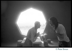 Sufi dancers bowing to one another inside the dome at the Lama Foundation