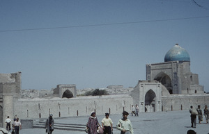 People outside an ancient mausoleum complex in Samarkand