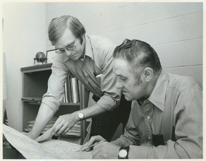 Roy Rule and Joe Park reading a map