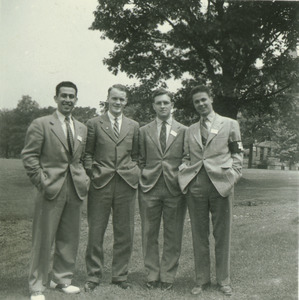 Unidentified men posing on campus lawn