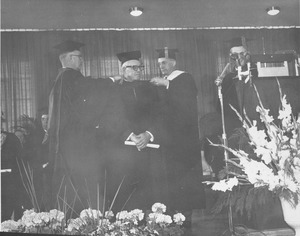 George Meany at his hooding ceremony during the Centennial Charter Day convocation