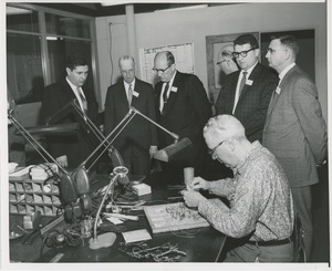 Attendees at a joint meeting of the American society of tool engineers and ICD observing a worker