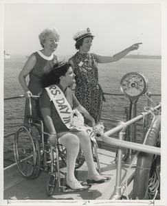 Mrs. Day in the sun on bridge of ship