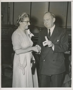 Jeremiah Milbank awarding woman