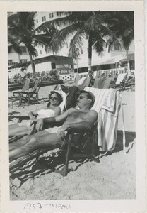 Bernice and David Kahn seated on the beach