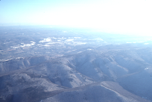 Oblique aerial photos accompanying 22 Dec 1994 Col-East air photo mission. 7. MT. Greylock massif with Mt. Prospect in the foreground and Adams, MA in the background.