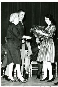 Dorothy "Dottie Mac" MacNamara receiving flowers at a Suffolk University award ceremony