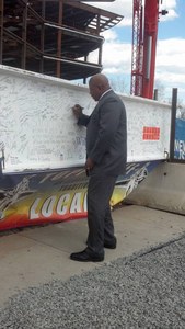 Chancellor Motley signs last beam of new General Academic Building