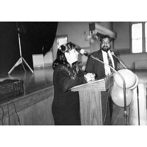 Man and woman at the podium at the Jorge Hernandez Cultural Center.