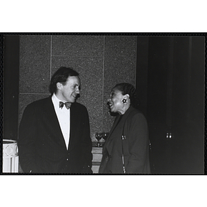 Frances K. Moseley, President and CEO of the Boys and Girls Clubs of Boston, at right, talks to an unidentified man at the Boys and Girls Clubs of Boston 100th Anniversary Celebration Dinner Dance and Auction at International Place, Boston